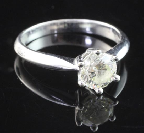 An 18ct white gold and solitaire diamond ring, size P.